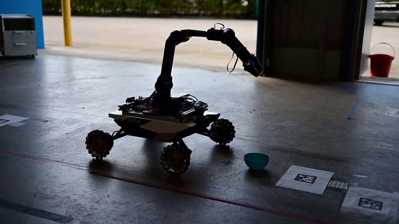Mobile manipulator picking up an object